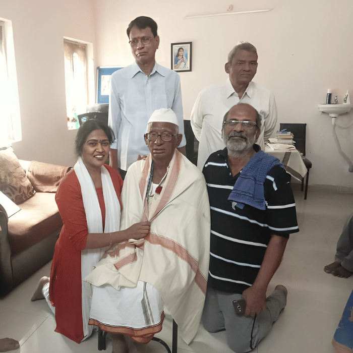 Felicitation of elderly man at charitable home